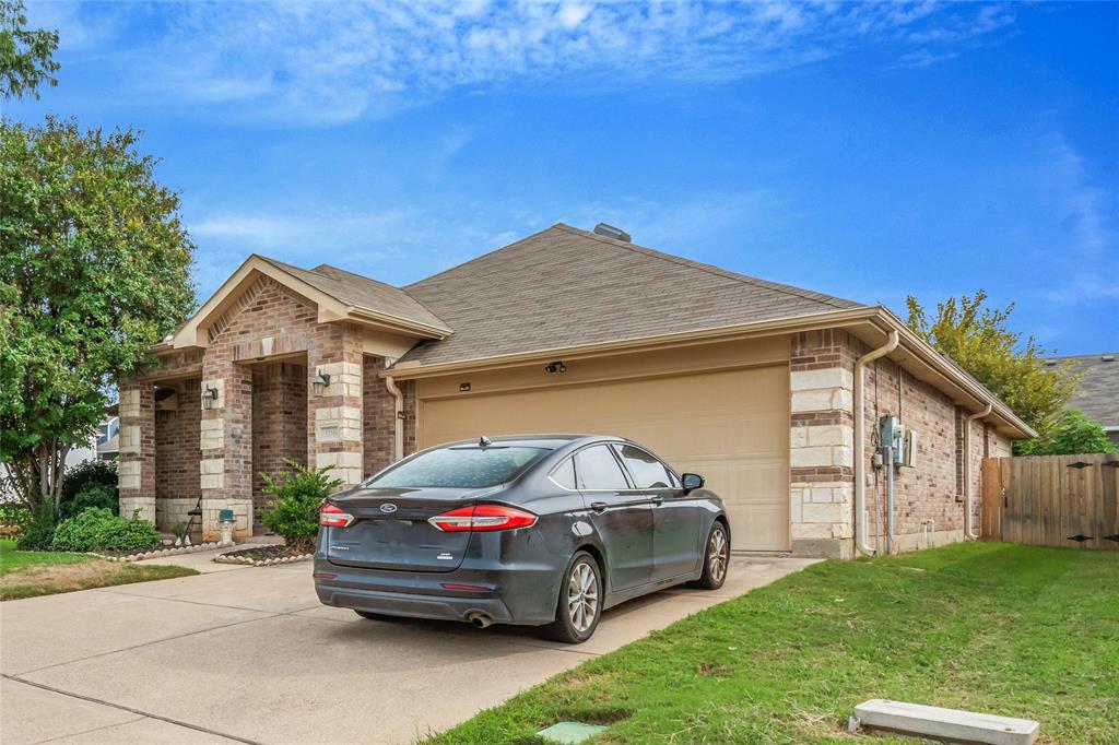 3216 Jetranger Road Fort Worth, TX 76053 - Photo 4 of 35 Ranch-style home with brick siding, concrete driveway, a garage, and a shingled roof