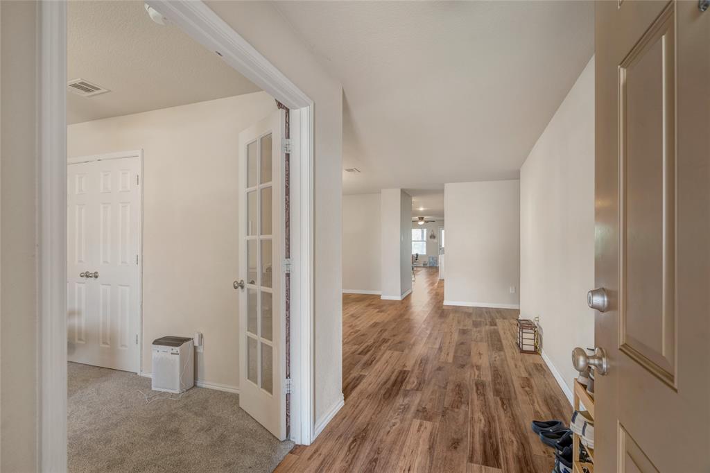 3216 Jetranger Road Fort Worth, TX 76053 - Photo 6 of 35 Hallway with baseboards and wood finished floors