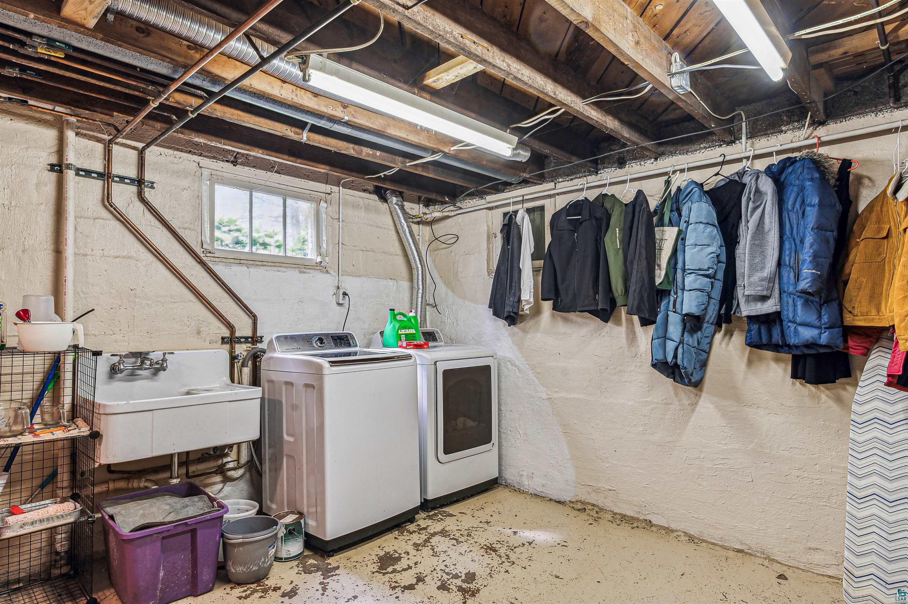4516 Gladstone Street Duluth, MN 55804 - Photo 15 of 20 Basement featuring sink and washer and clothes dryer
