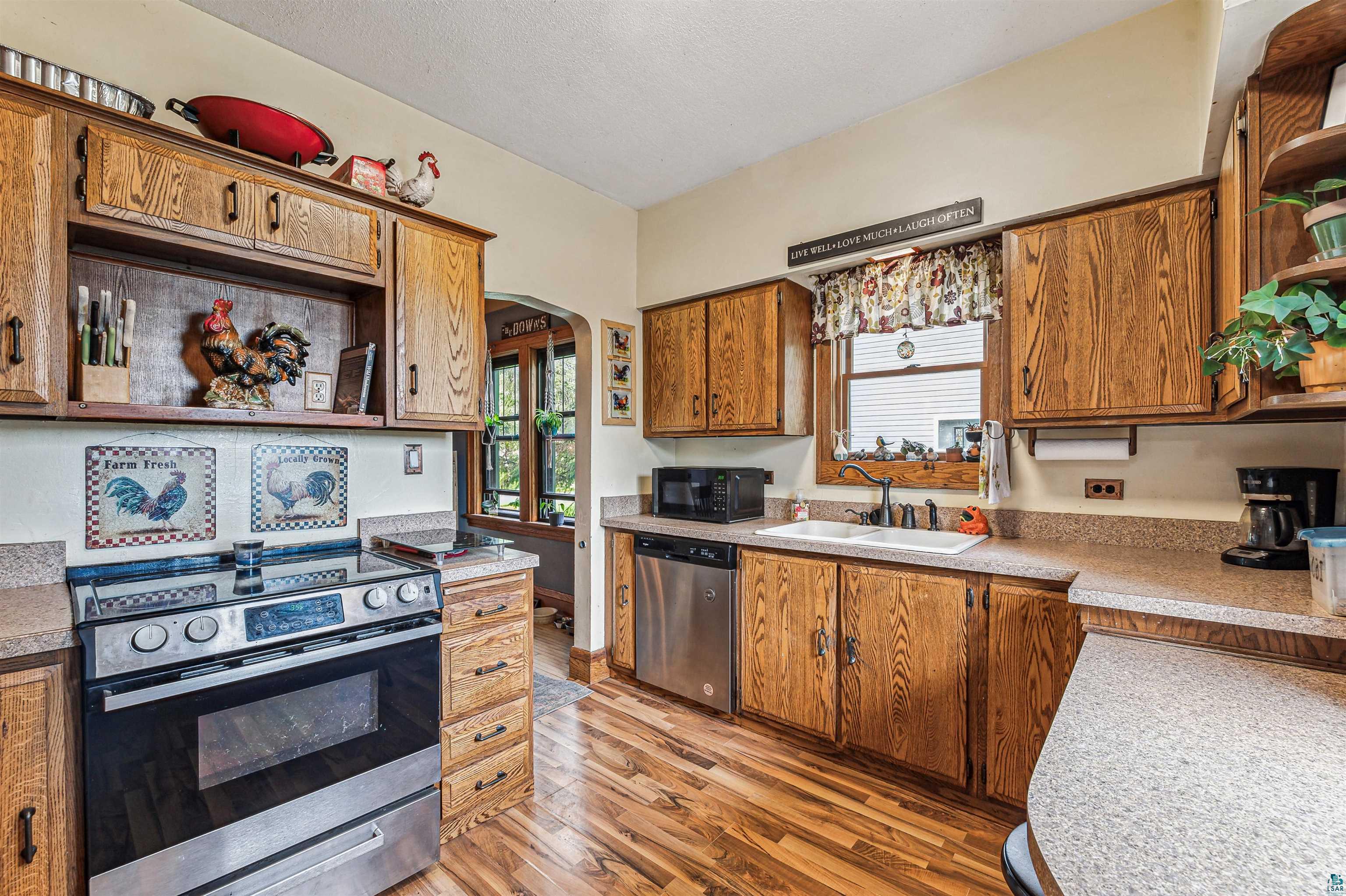 4516 Gladstone Street Duluth, MN 55804 - Photo 5 of 20 Kitchen with appliances with stainless steel finishes, sink, and light hardwood / wood-style flooring