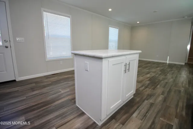 a view of livingroom with hardwood floor and a ceiling fan