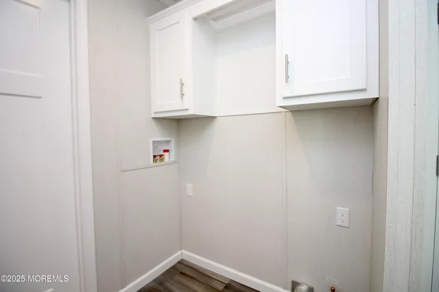a bathroom with a sink and cabinets