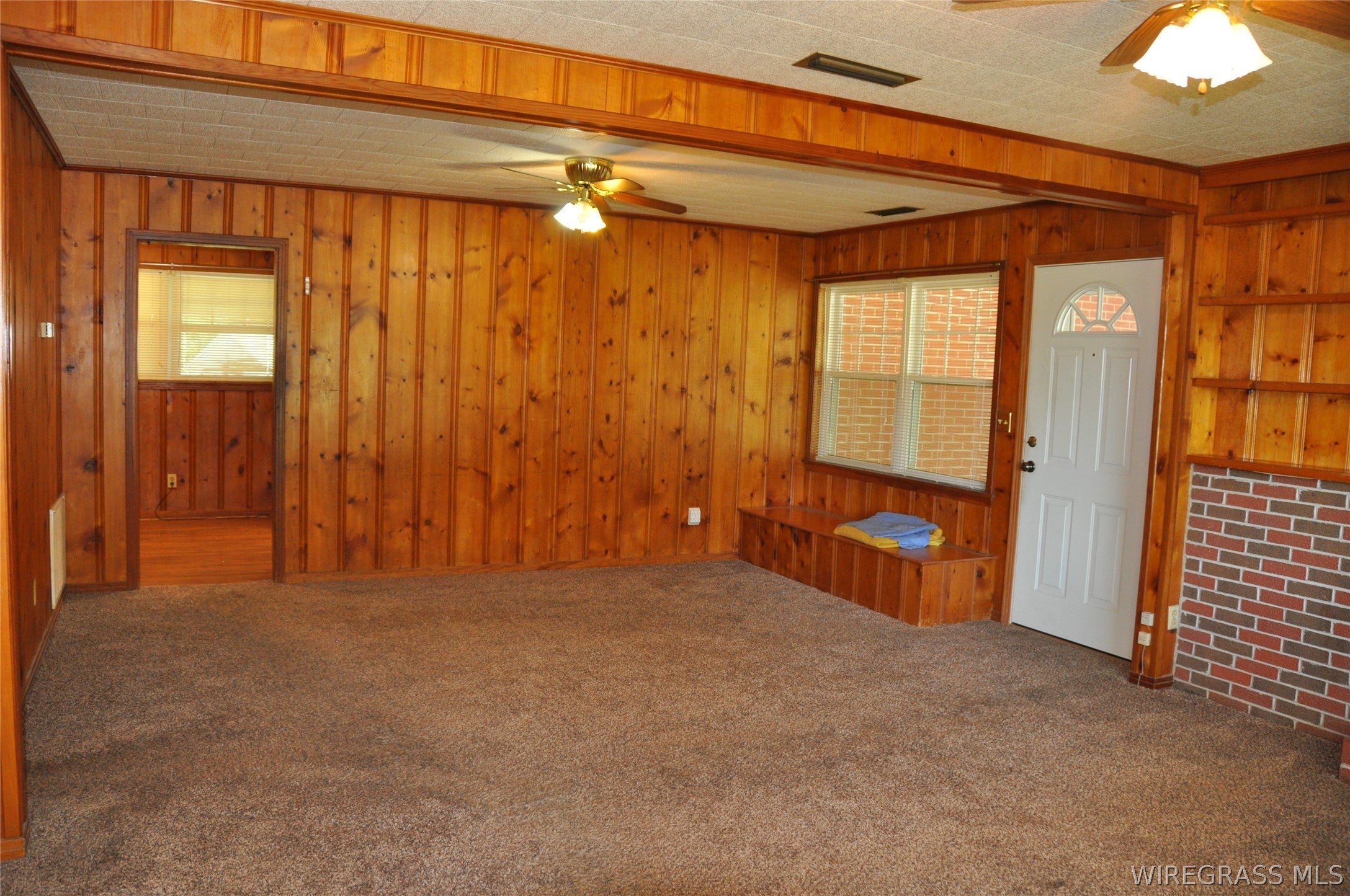 910 Holley Mill Road Samson, AL 36477 - Photo 2 of 61 The front door opens into the large living room.