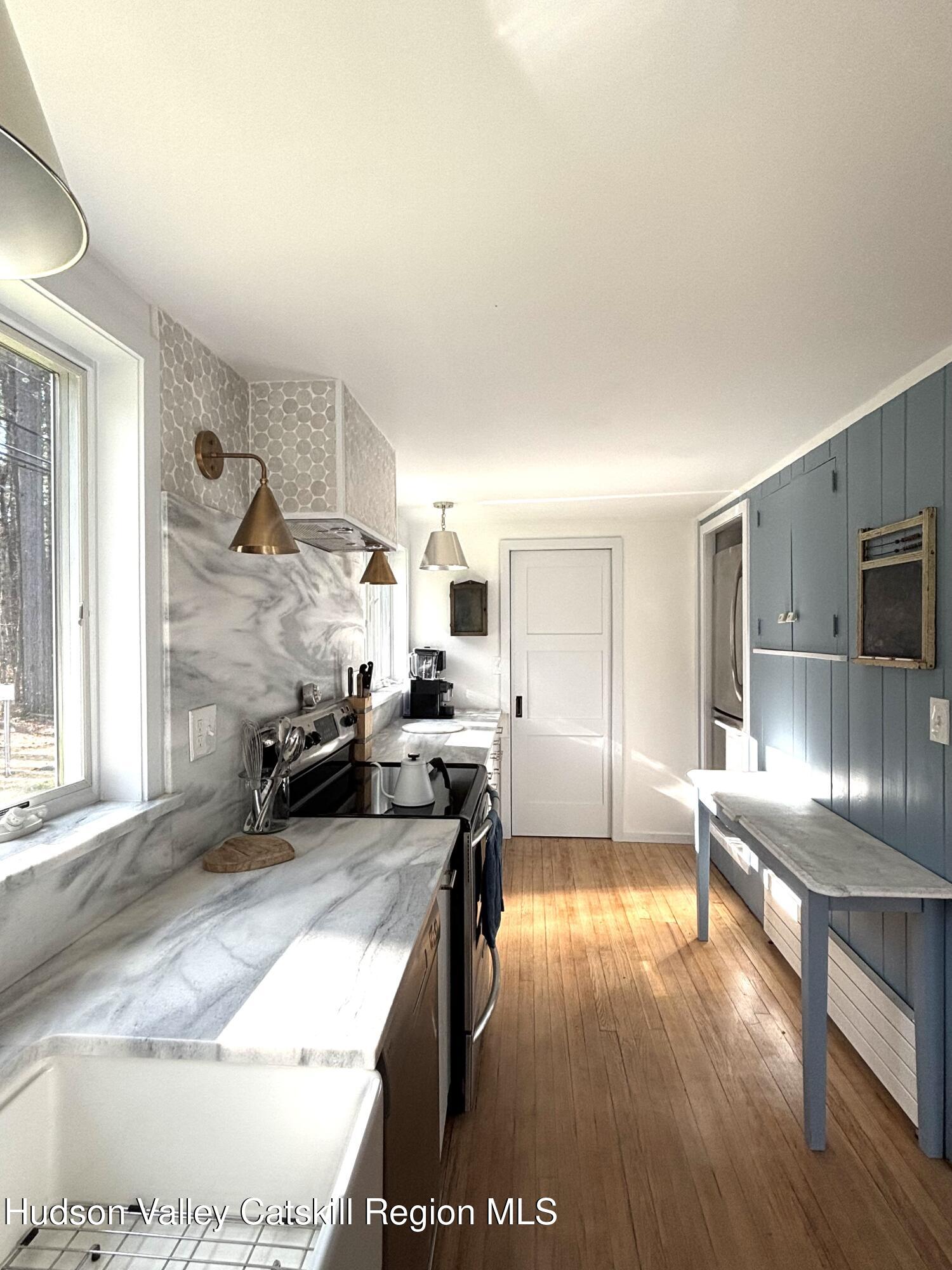 299 Wittenberg Road Woodstock, NY 12409 - Photo 12 of 49 a living room with furniture and a wooden floor