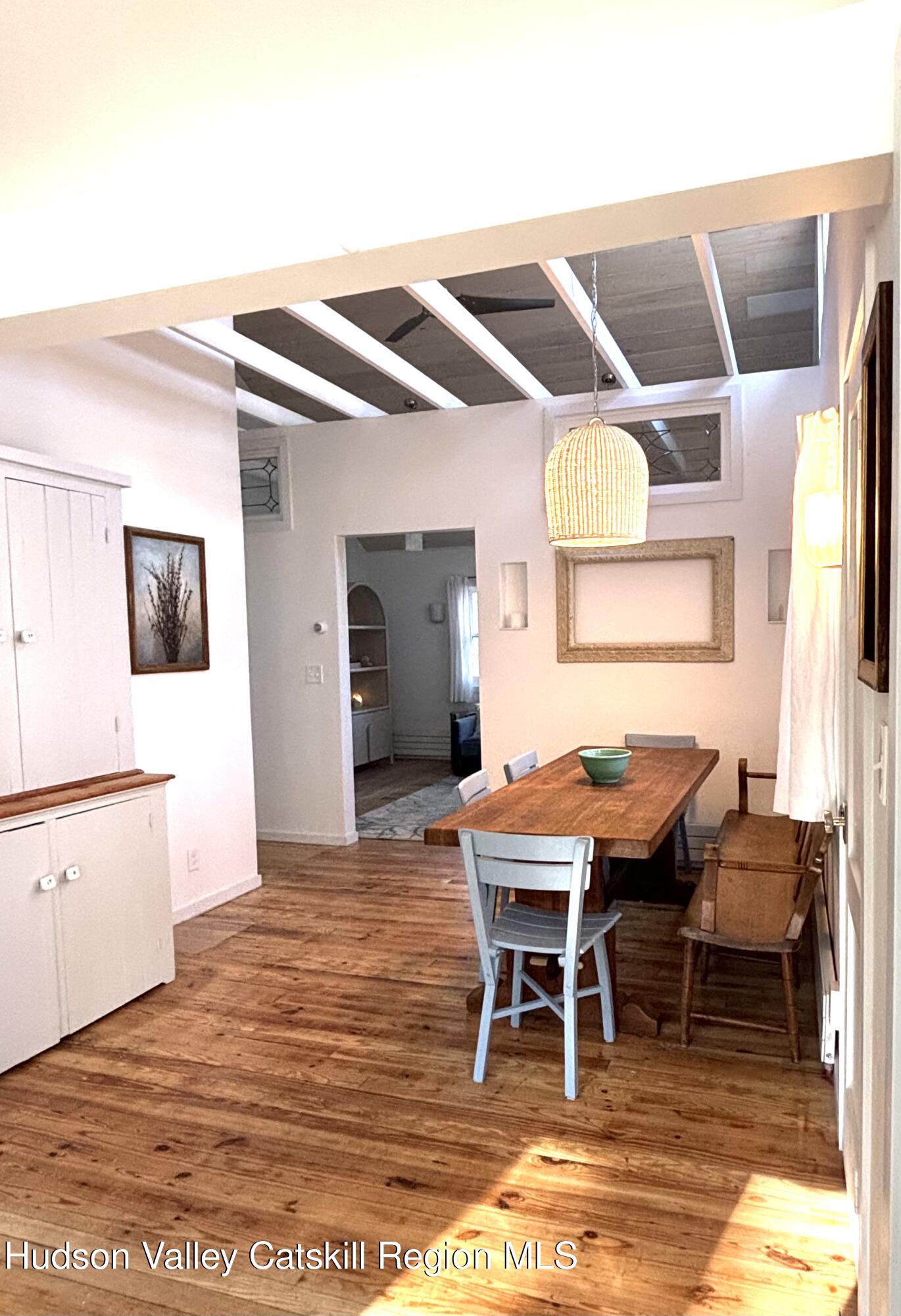 299 Wittenberg Road Woodstock, NY 12409 - Photo 15 of 49 a view of a dining room with furniture and wooden floor