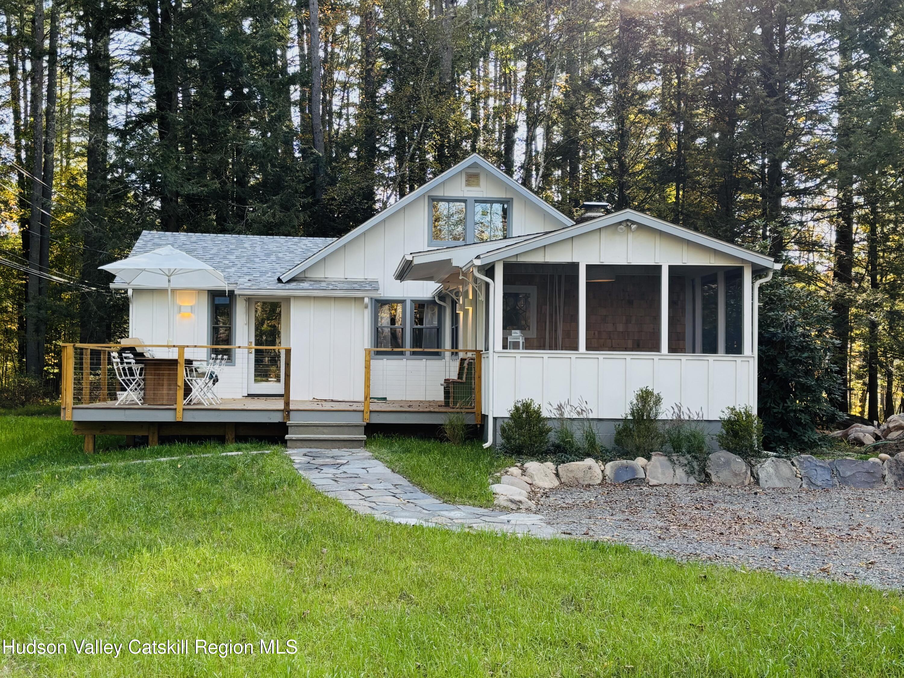 299 Wittenberg Road Woodstock, NY 12409 - Photo 2 of 49 a front view of a house with a yard and porch