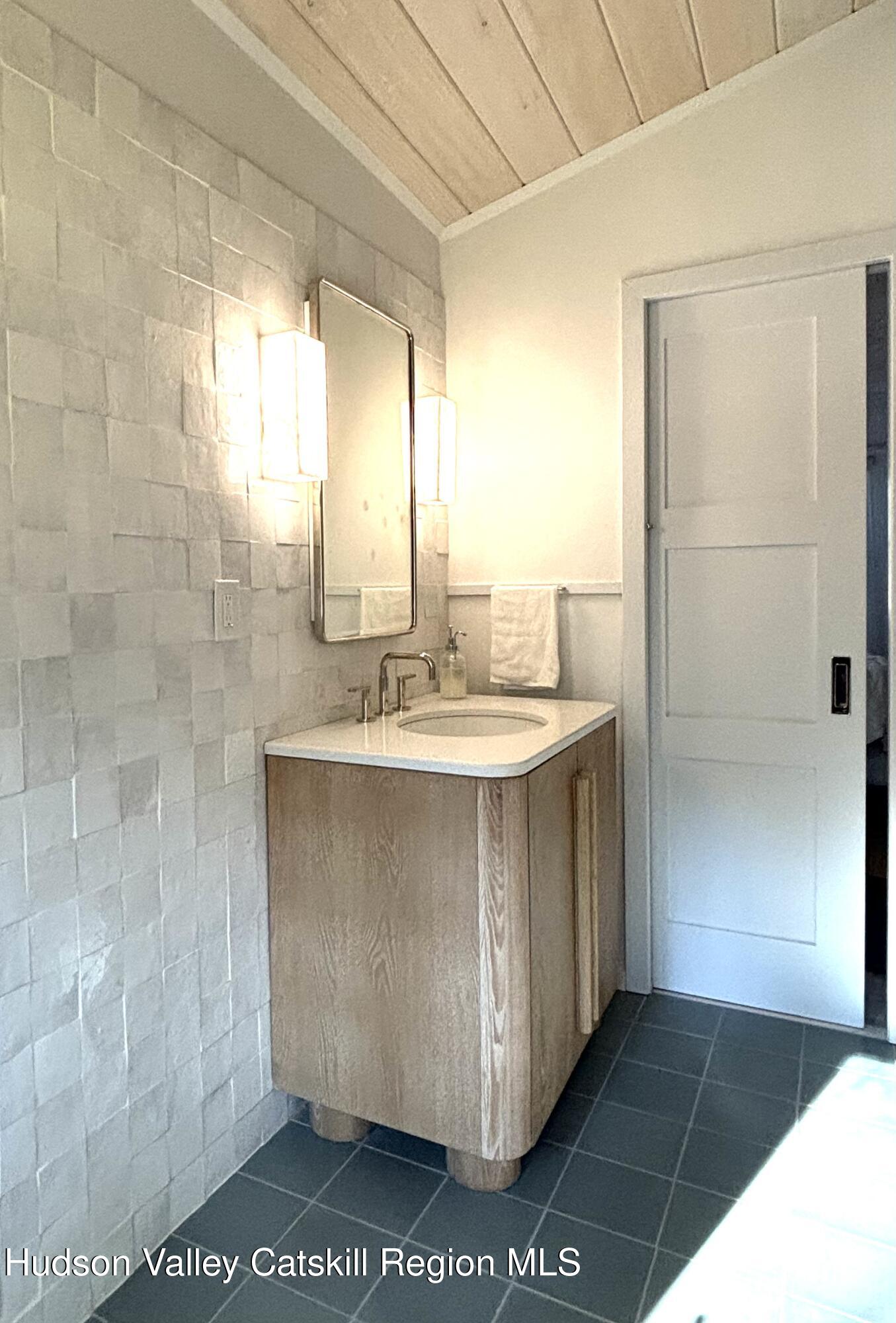 299 Wittenberg Road Woodstock, NY 12409 - Photo 27 of 49 a bathroom with a sink and a mirror