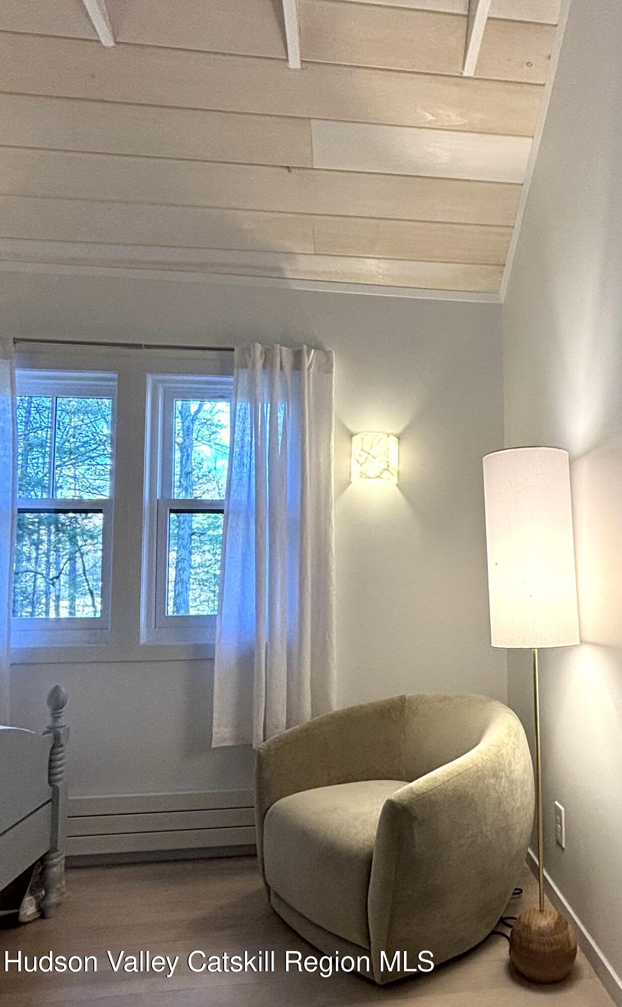 299 Wittenberg Road Woodstock, NY 12409 - Photo 30 of 49 a living room with a couch and a window