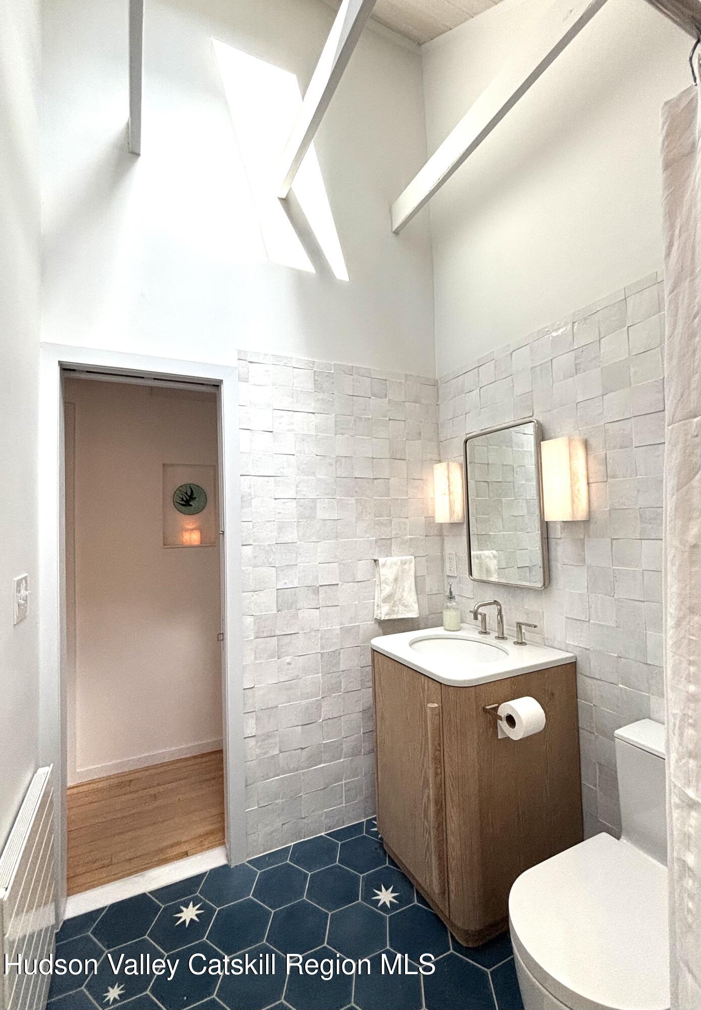 299 Wittenberg Road Woodstock, NY 12409 - Photo 32 of 49 a bathroom with a sink a toilet and shower