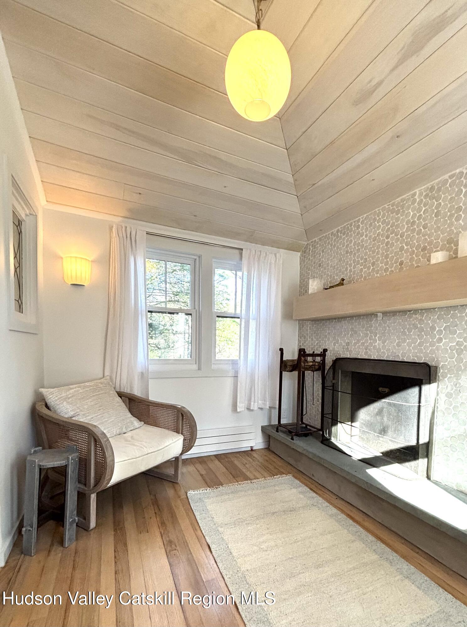 299 Wittenberg Road Woodstock, NY 12409 - Photo 36 of 49 a living room with a couch and a table