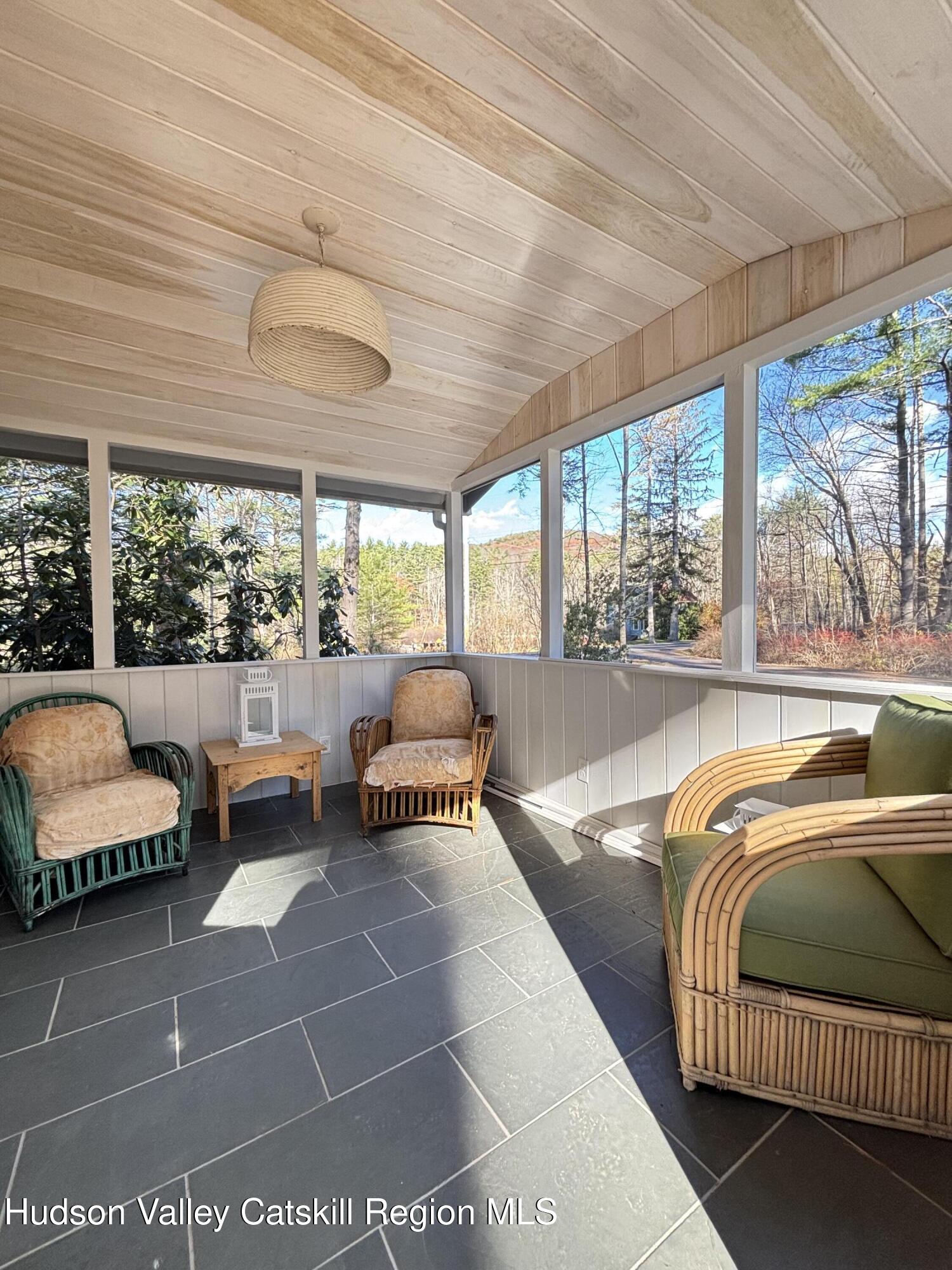 299 Wittenberg Road Woodstock, NY 12409 - Photo 45 of 49 a living room with furniture and a floor to ceiling window