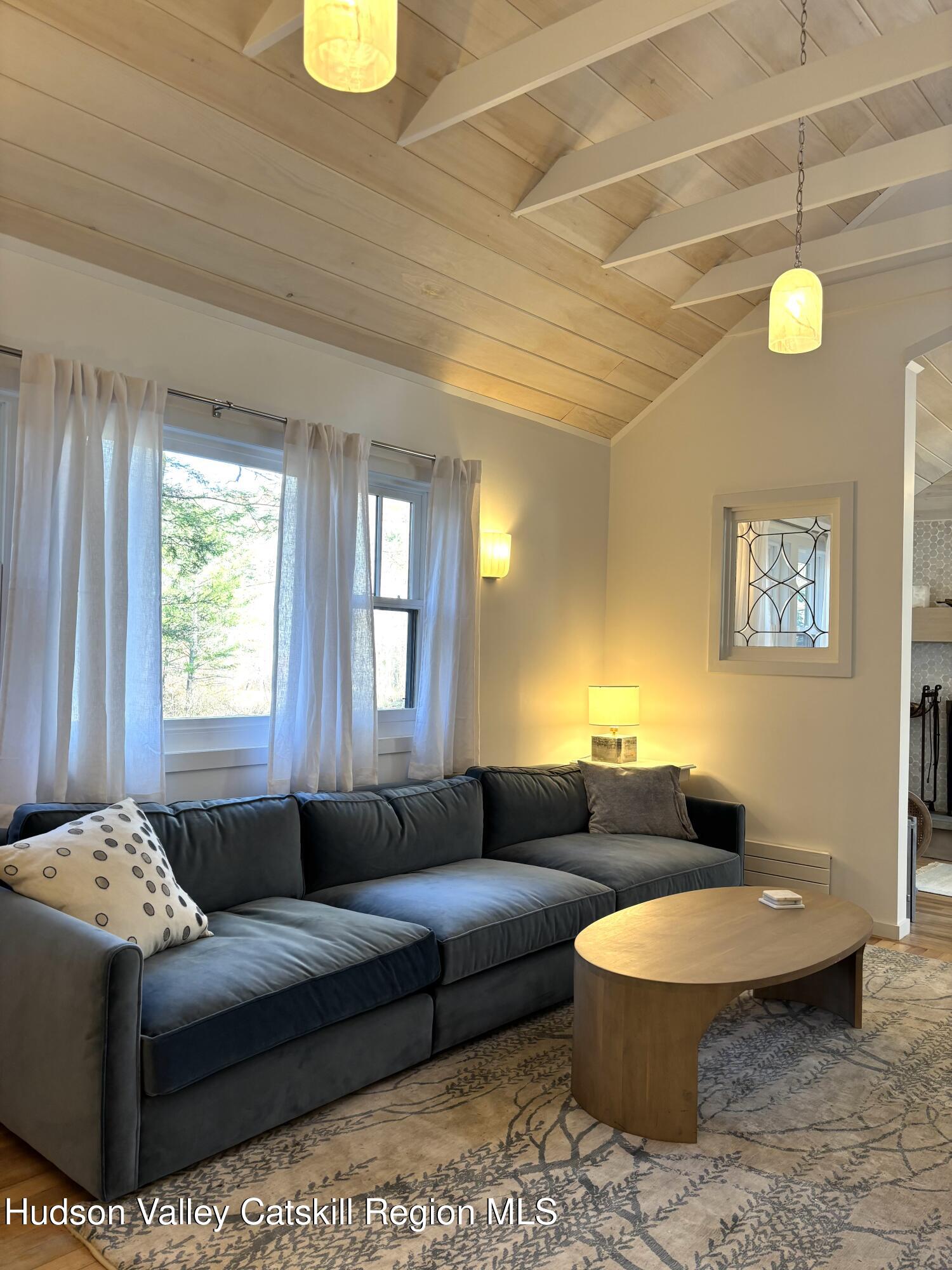 299 Wittenberg Road Woodstock, NY 12409 - Photo 10 of 49 a living room with furniture and a window