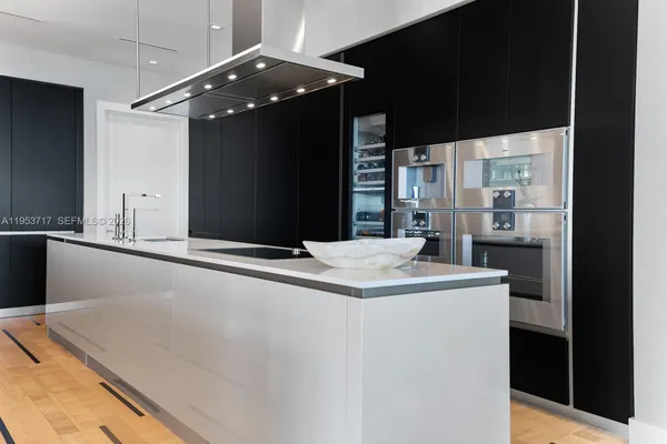 a view of room with stairs and furniture