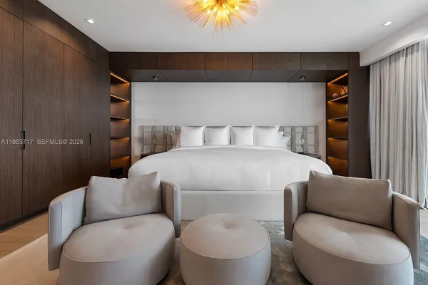 a bathroom with a granite countertop sink mirror and shower