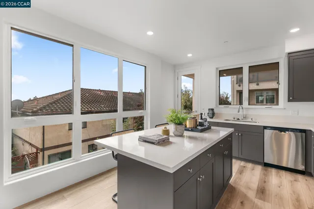 a kitchen with sink and window