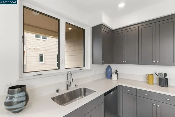 a kitchen with a sink and cabinets