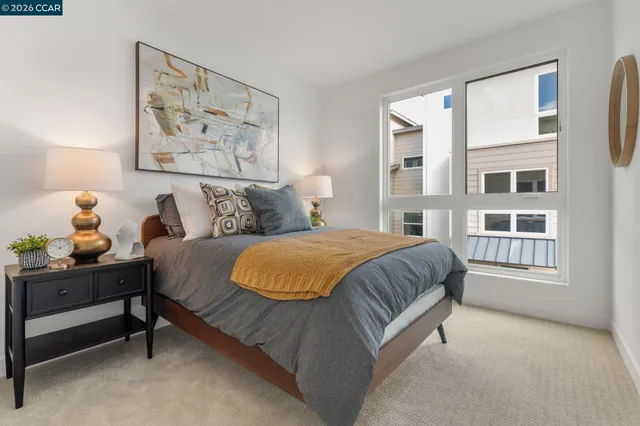 a spacious bedroom with a bed and a window