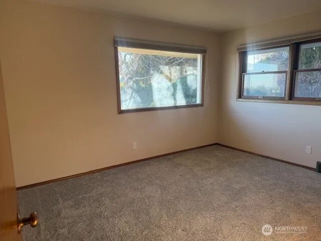 an empty room with windows