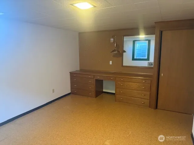a view of an empty room with a bathroom