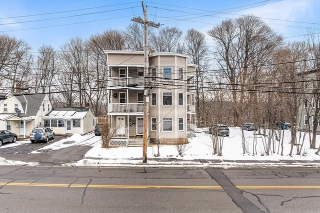 a front view of a building with street view
