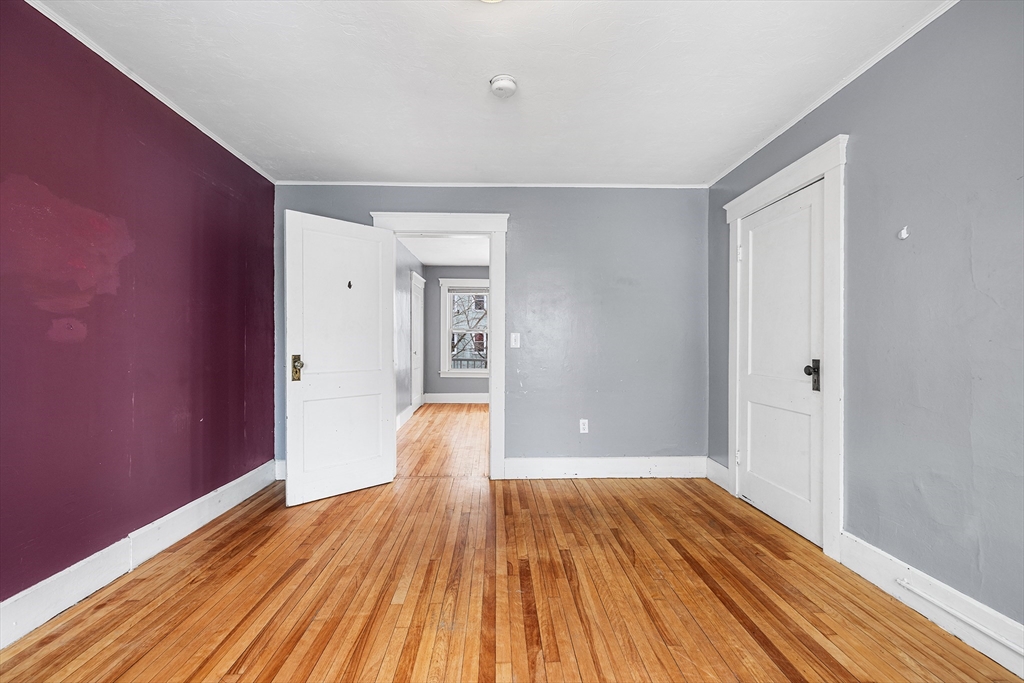 748 Water Street Fitchburg, MA 01420 - Photo 18 of 39 a view of a room with wooden floor and bench