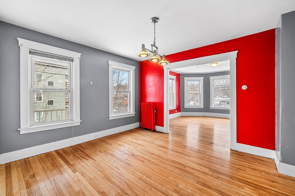 748 Water Street Fitchburg, MA 01420 - Photo 21 of 39 a view of empty room with wooden floor and fan