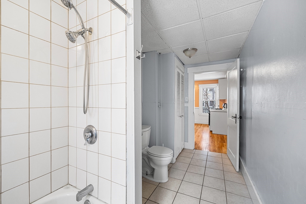 748 Water Street Fitchburg, MA 01420 - Photo 22 of 39 a bathroom with a shower and a toilet