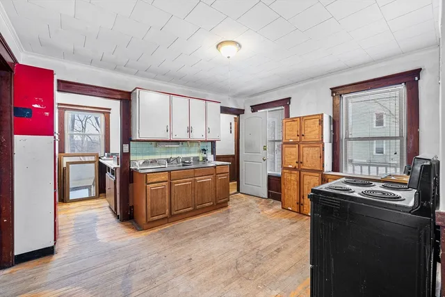 a kitchen with stainless steel appliances granite countertop a refrigerator a stove a sink dishwasher and a refrigerator