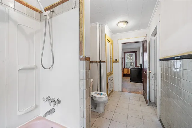 a bathroom with a granite countertop shower and a sink