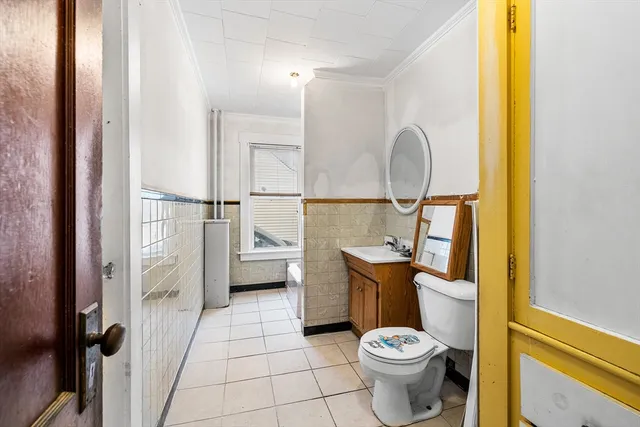 a bathroom with a toilet and a sink