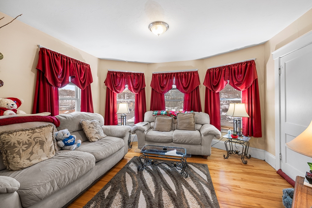 748 Water Street Fitchburg, MA 01420 - Photo 7 of 39 a living room with furniture and a large window
