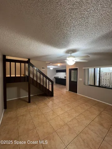 a kitchen with kitchen island sink and cabinets