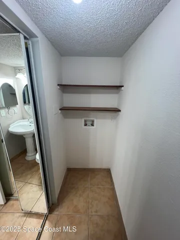 a view of a room with an empty room and floor to ceiling window