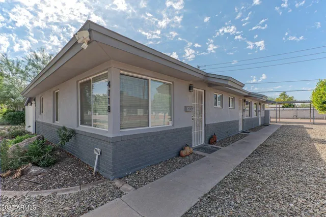 a view of house with backyard porch and outdoor seating