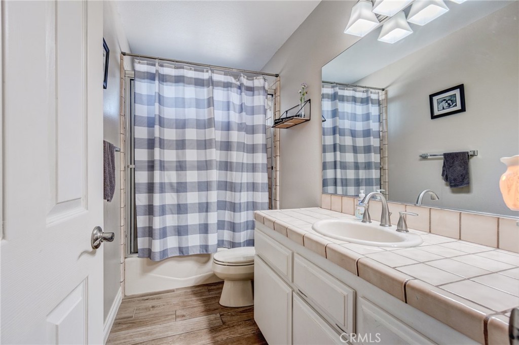 10163 Ponderosa Road Pinon Hills, CA 92372 - Photo 12 of 35 a bathroom with a sink a toilet a shower and a mirror