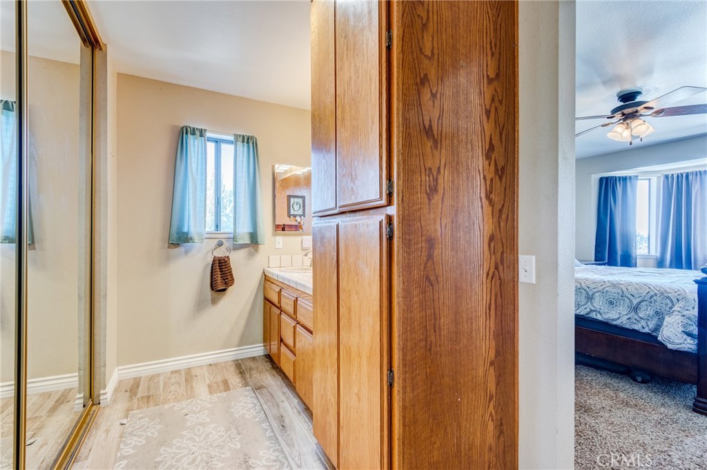 10163 Ponderosa Road Pinon Hills, CA 92372 - Photo 18 of 35 a bathroom with a sink a toilet and shower