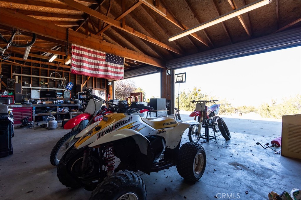 10163 Ponderosa Road Pinon Hills, CA 92372 - Photo 26 of 35 a view of a storage room with lots of stuff