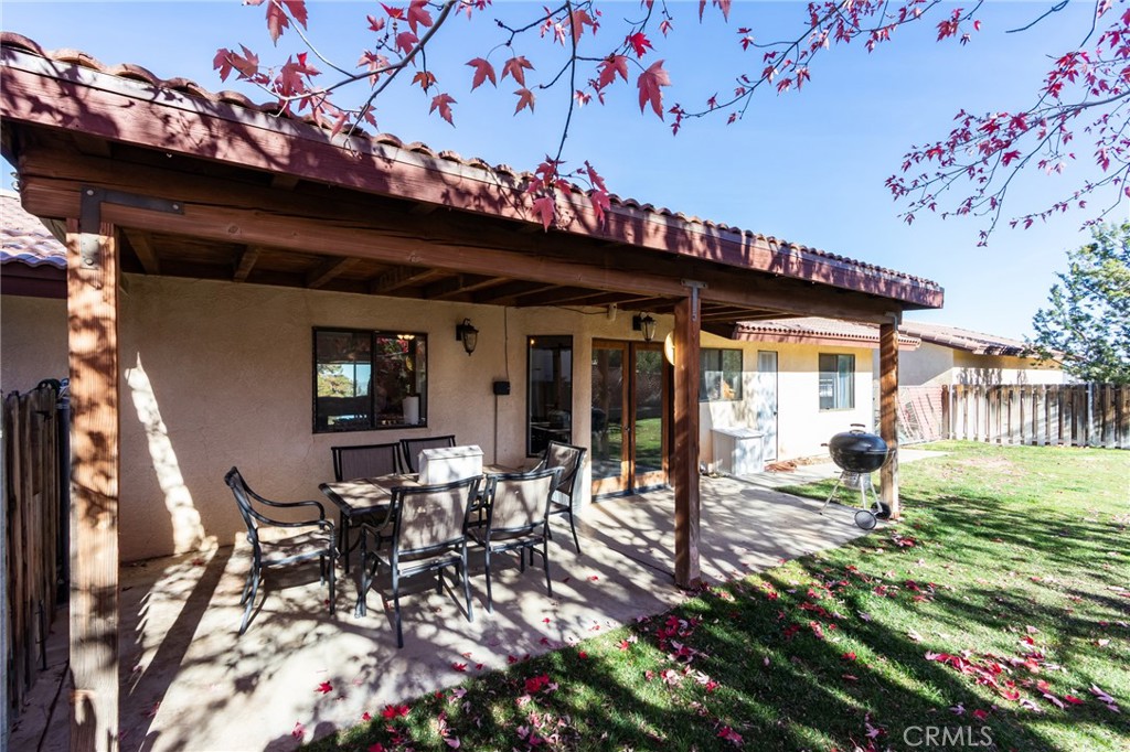 10163 Ponderosa Road Pinon Hills, CA 92372 - Photo 27 of 35 a view of a patio with table and chairs and potted plants