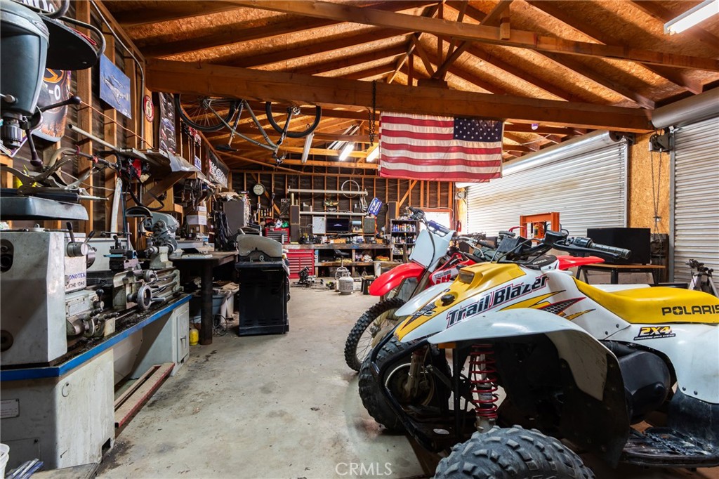 10163 Ponderosa Road Pinon Hills, CA 92372 - Photo 30 of 35 a view of a garage with storage