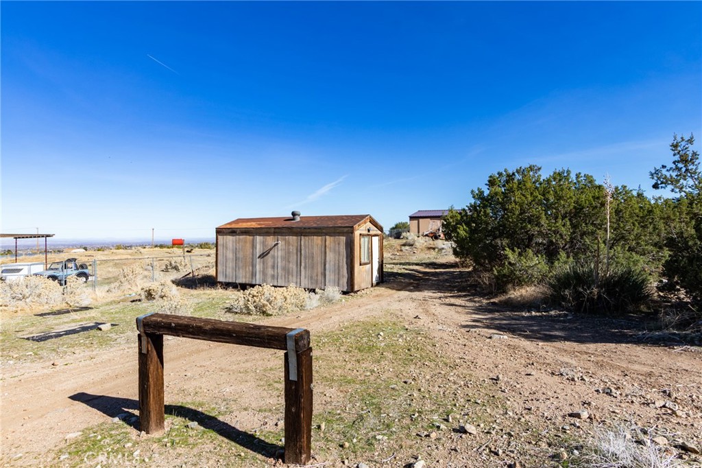 10163 Ponderosa Road Pinon Hills, CA 92372 - Photo 34 of 35 a view of a yard with an outdoor space
