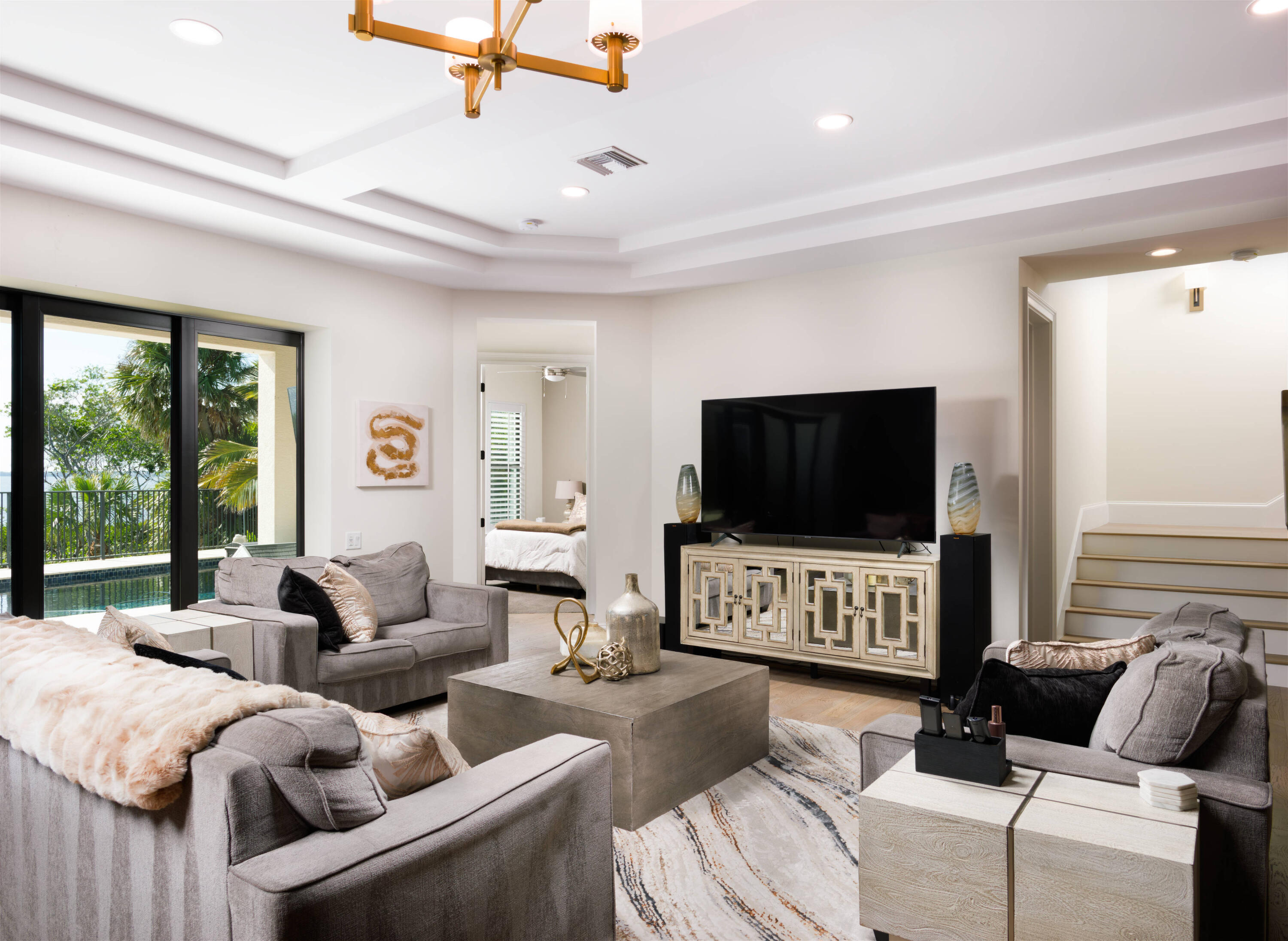 7683 Pelican Pointe Drive Jensen Beach, FL 34957 - Photo 12 of 40 a living room with furniture and a flat screen tv