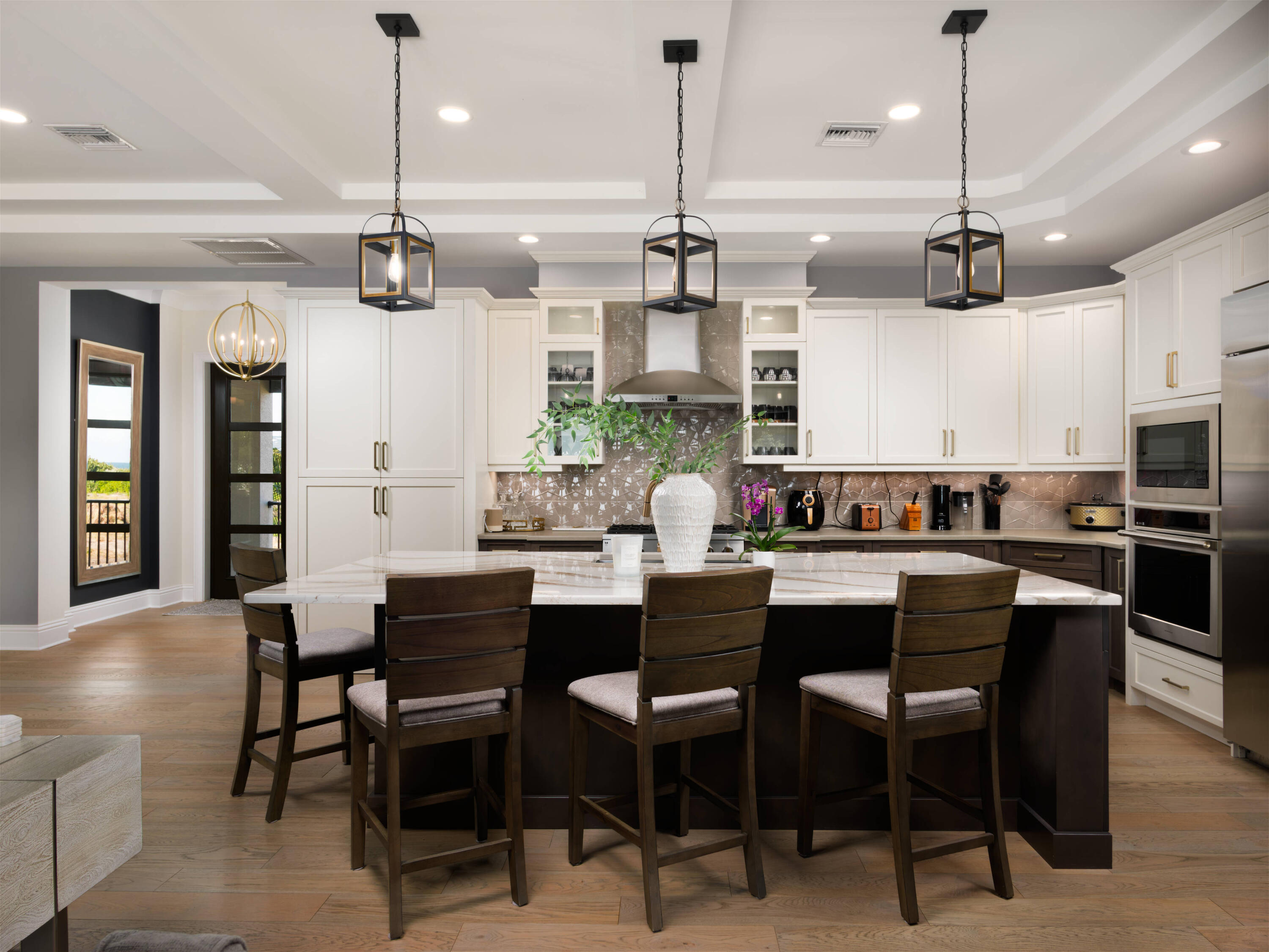 7683 Pelican Pointe Drive Jensen Beach, FL 34957 - Photo 14 of 40 a kitchen with a table and chairs in it