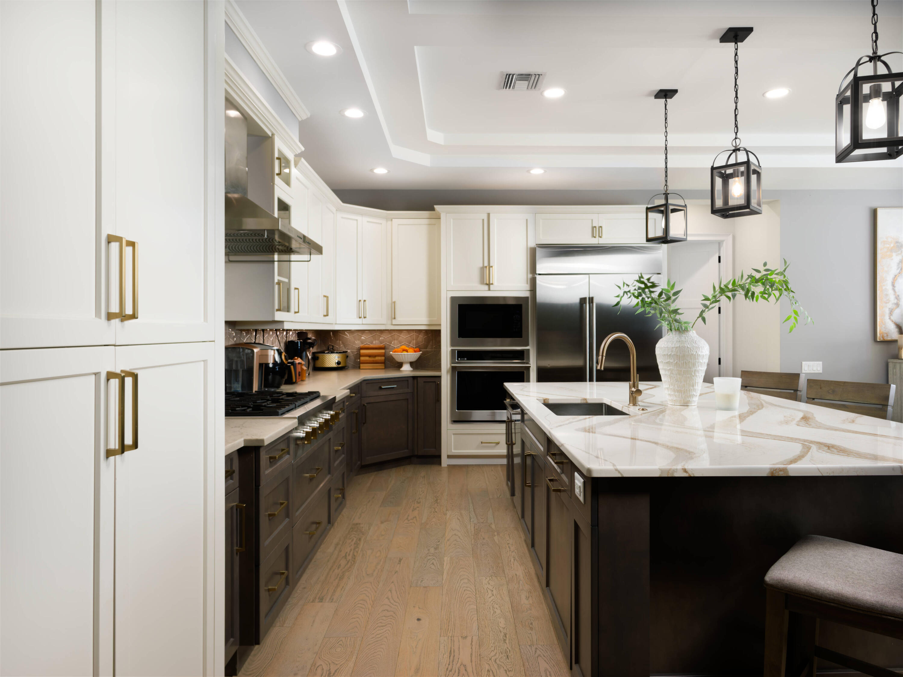 7683 Pelican Pointe Drive Jensen Beach, FL 34957 - Photo 15 of 40 a kitchen with kitchen island granite countertop lots of counter top space and appliances