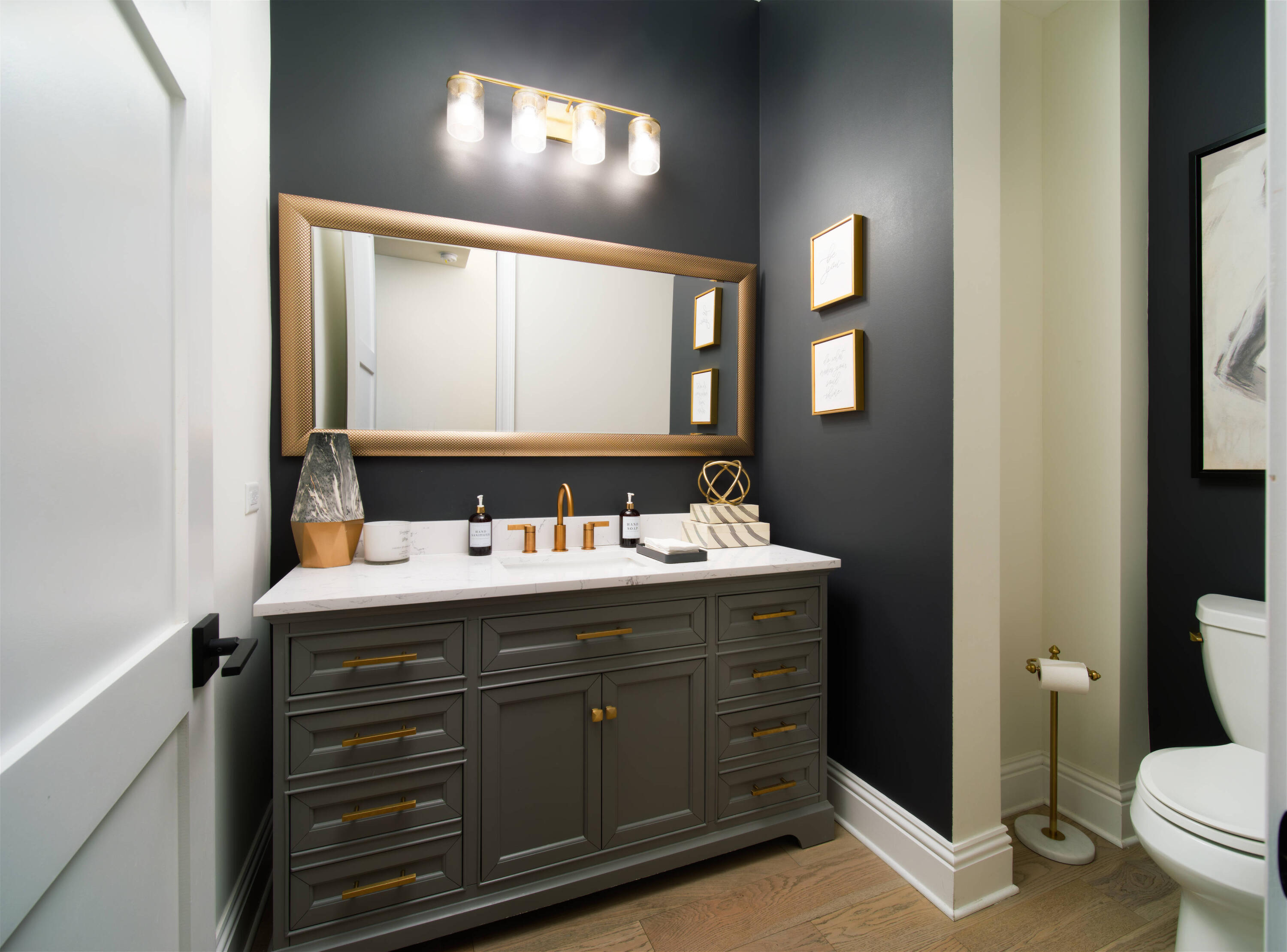 7683 Pelican Pointe Drive Jensen Beach, FL 34957 - Photo 17 of 40 a bathroom with a sink and mirror with toilet