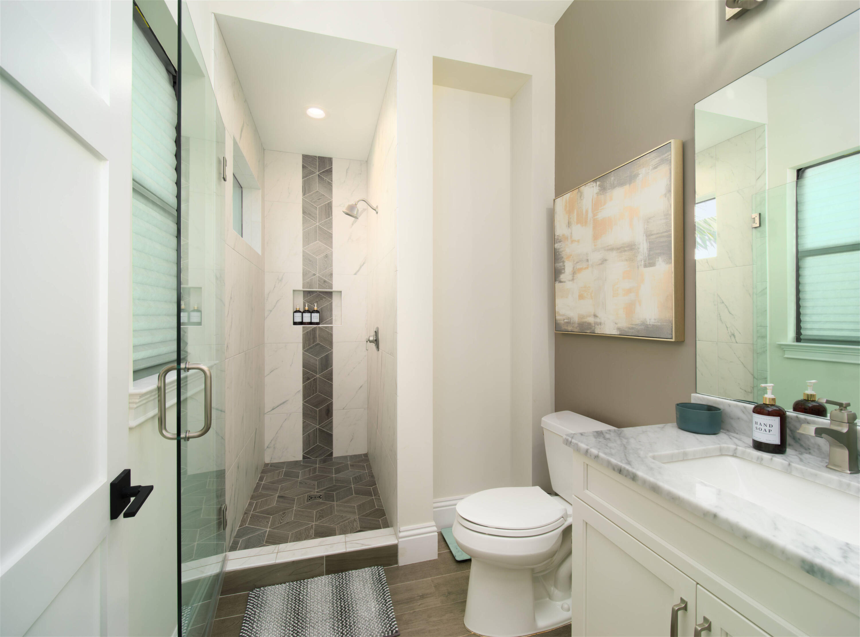 7683 Pelican Pointe Drive Jensen Beach, FL 34957 - Photo 21 of 40 a bathroom with a granite countertop sink toilet and shower