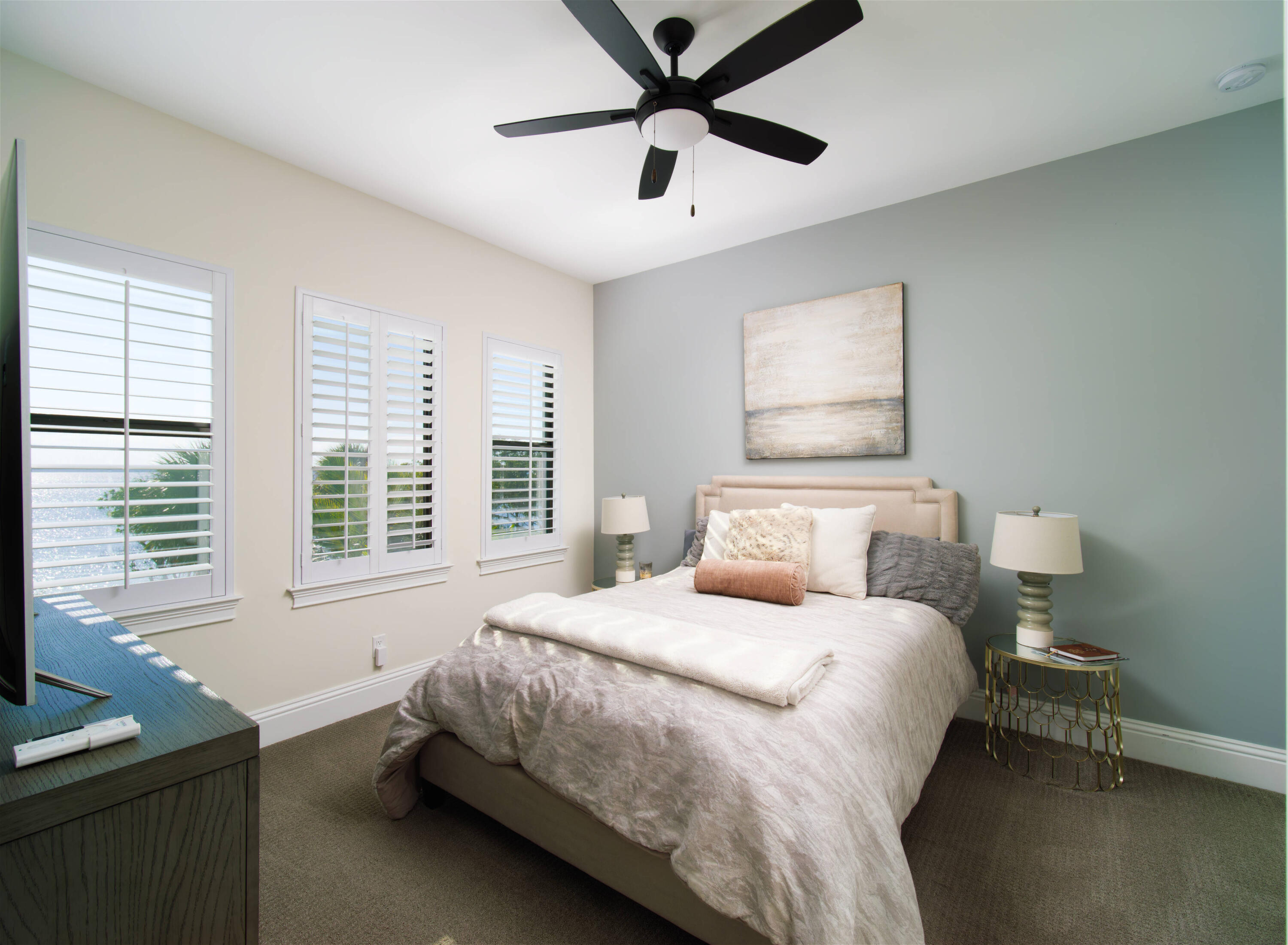 7683 Pelican Pointe Drive Jensen Beach, FL 34957 - Photo 22 of 40 a bedroom with a bed and a window