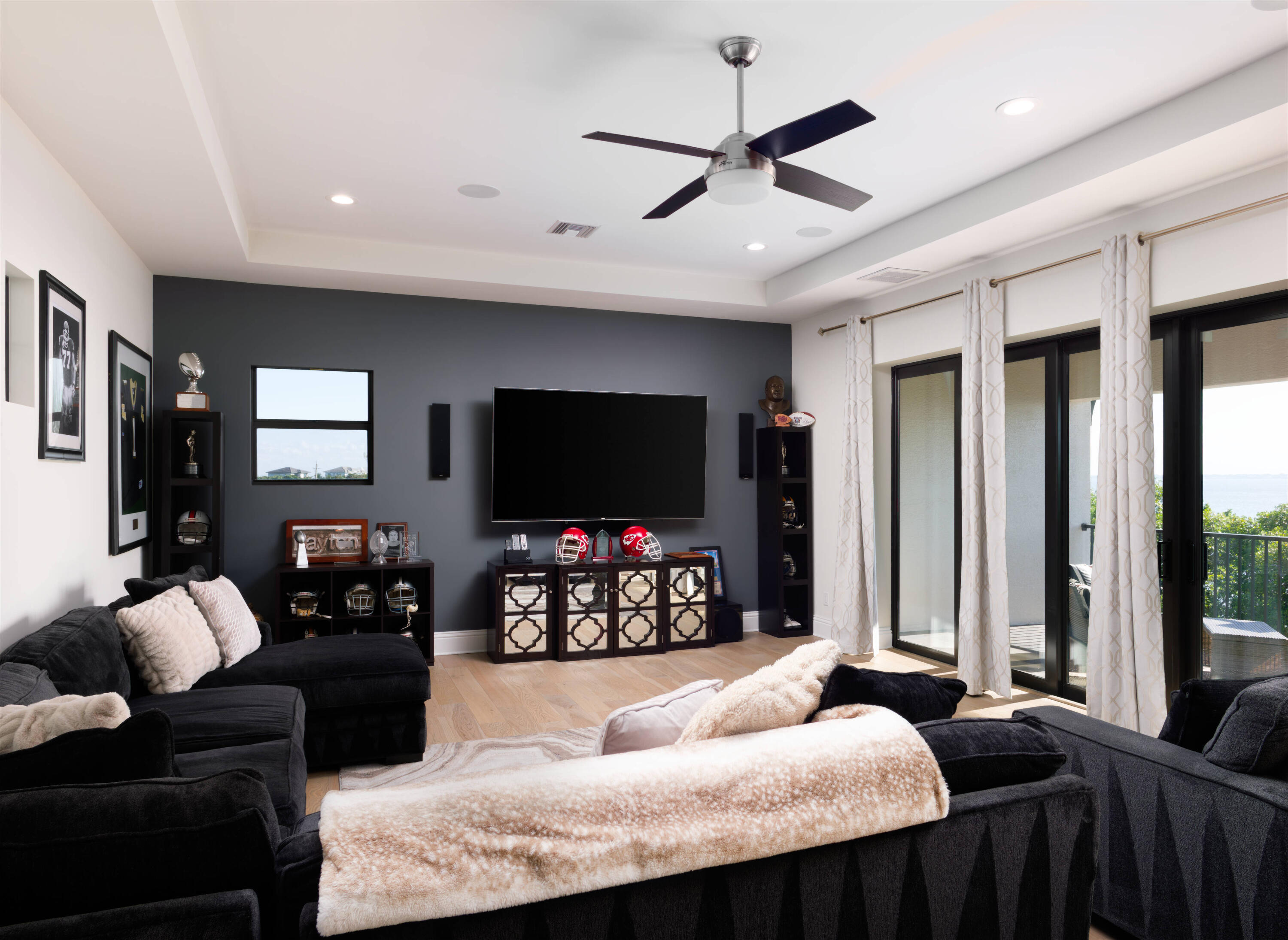 7683 Pelican Pointe Drive Jensen Beach, FL 34957 - Photo 26 of 40 a bedroom with furniture and a flat screen tv