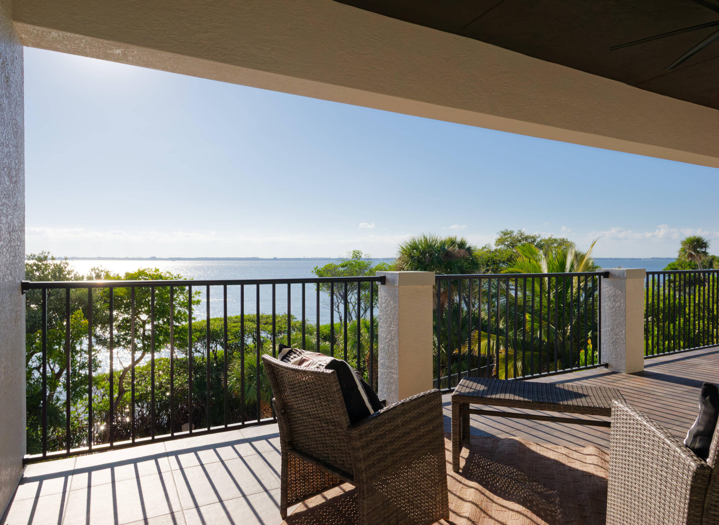 7683 Pelican Pointe Drive Jensen Beach, FL 34957 - Photo 28 of 40 a view of a balcony with lake view and wooden floor