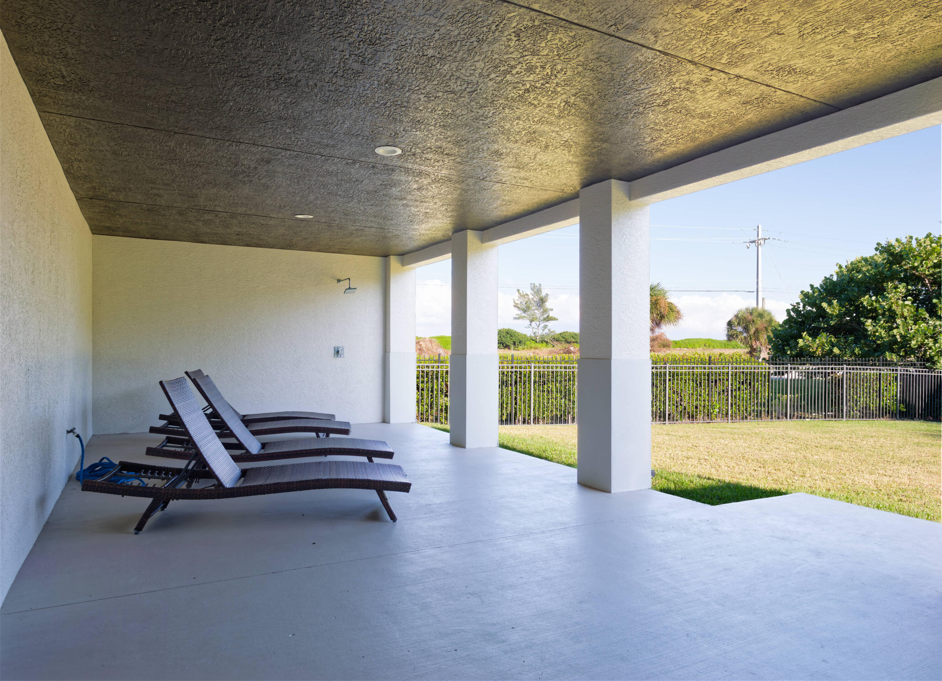 7683 Pelican Pointe Drive Jensen Beach, FL 34957 - Photo 29 of 40 a view of a patio with table and chairs