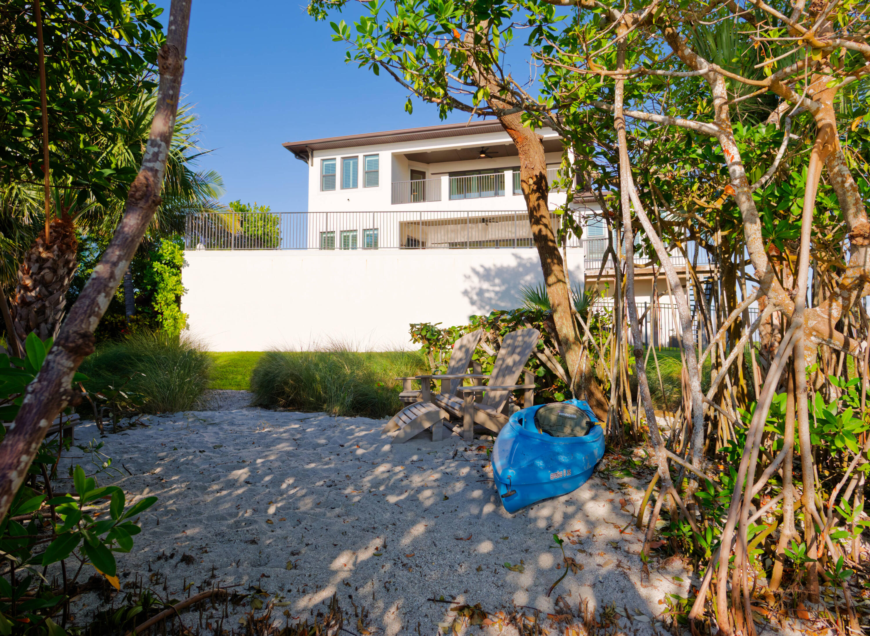 7683 Pelican Pointe Drive Jensen Beach, FL 34957 - Photo 32 of 40 a view of a house with a yard